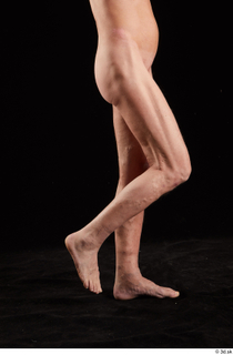 Joseph  1 calf flexing nude side view sitting 0002.jpg